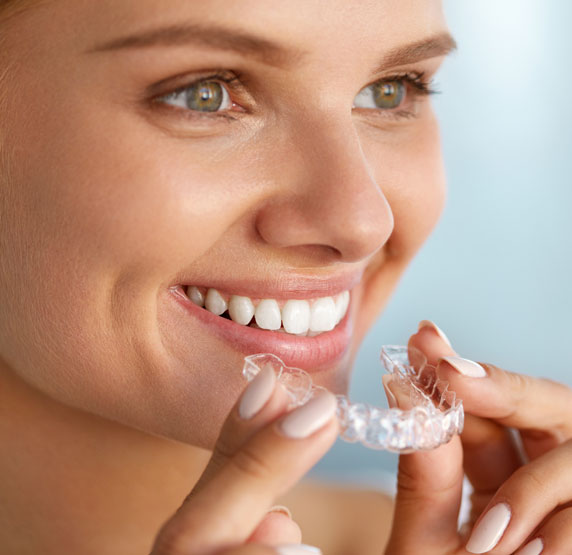 dental patient using take home teeth whitening kit Leesburg, VA