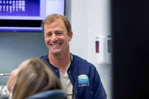 Dr. Gary Ashton with dental patient.
